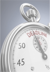 Stopwatch with hand approaching word 'Deadline'