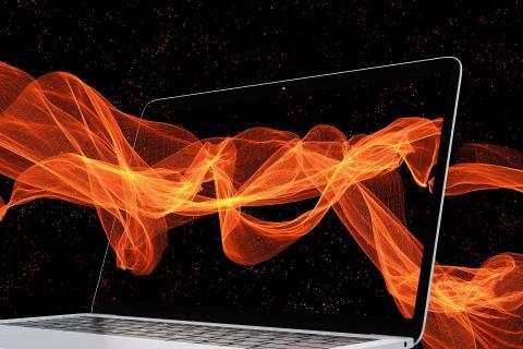 Laptop with waves of energy flowing throught it