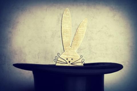 Cut-out rabbit emerging from hat